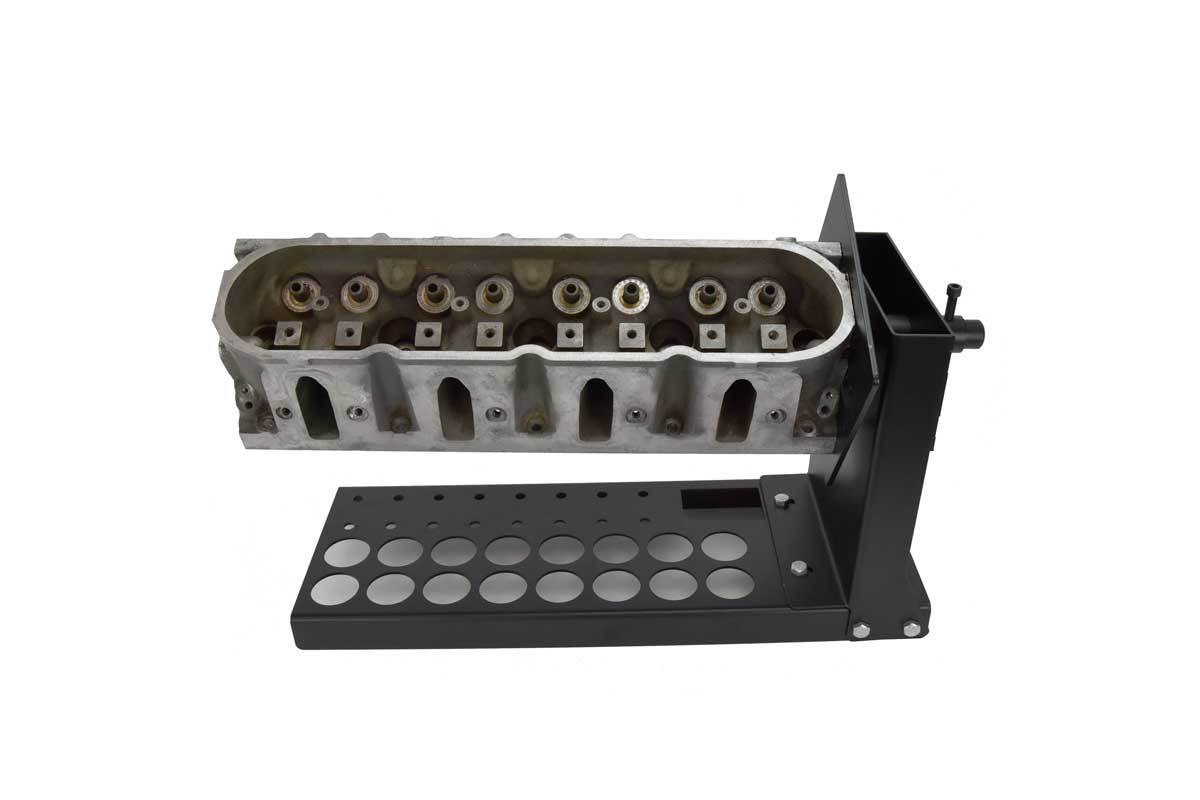 Rotating cylinder head stand with mounting plate with cylinder head attached and valve storage